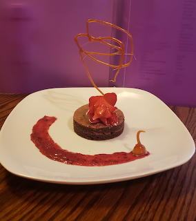 Chocolate cake with strawberry sauce