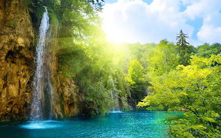 Waterfall and sunrays