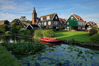 Marken Houses On Canal With Boat Netherlands