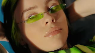 BillieEilish wearing neon green sunglasses