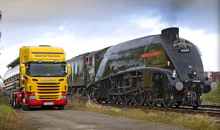 Truck delivers water for steam locomotive.