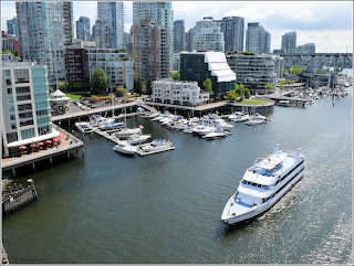 Yacht passing Condos Marina False Creek